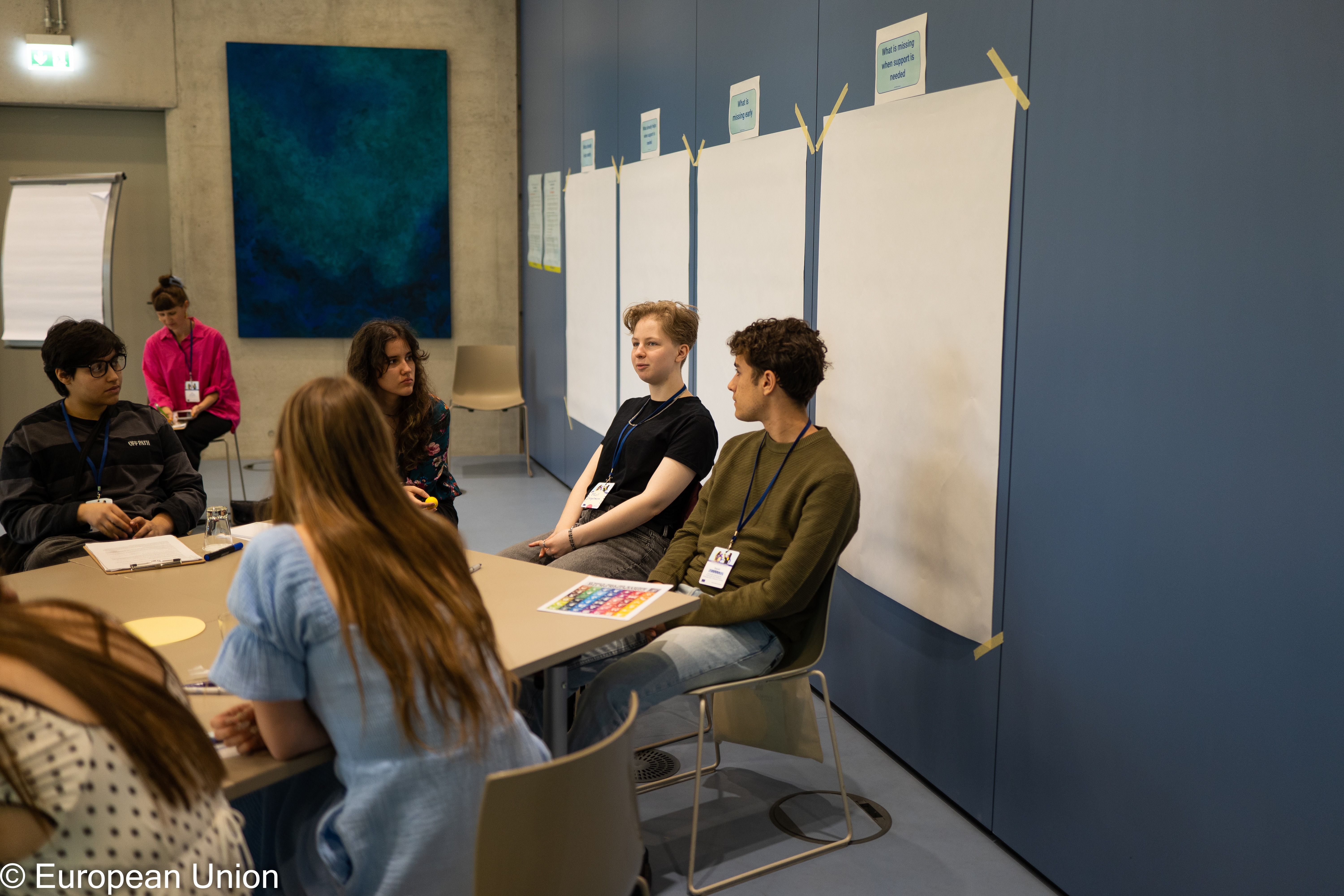 The group of young people in discussion during a workshop