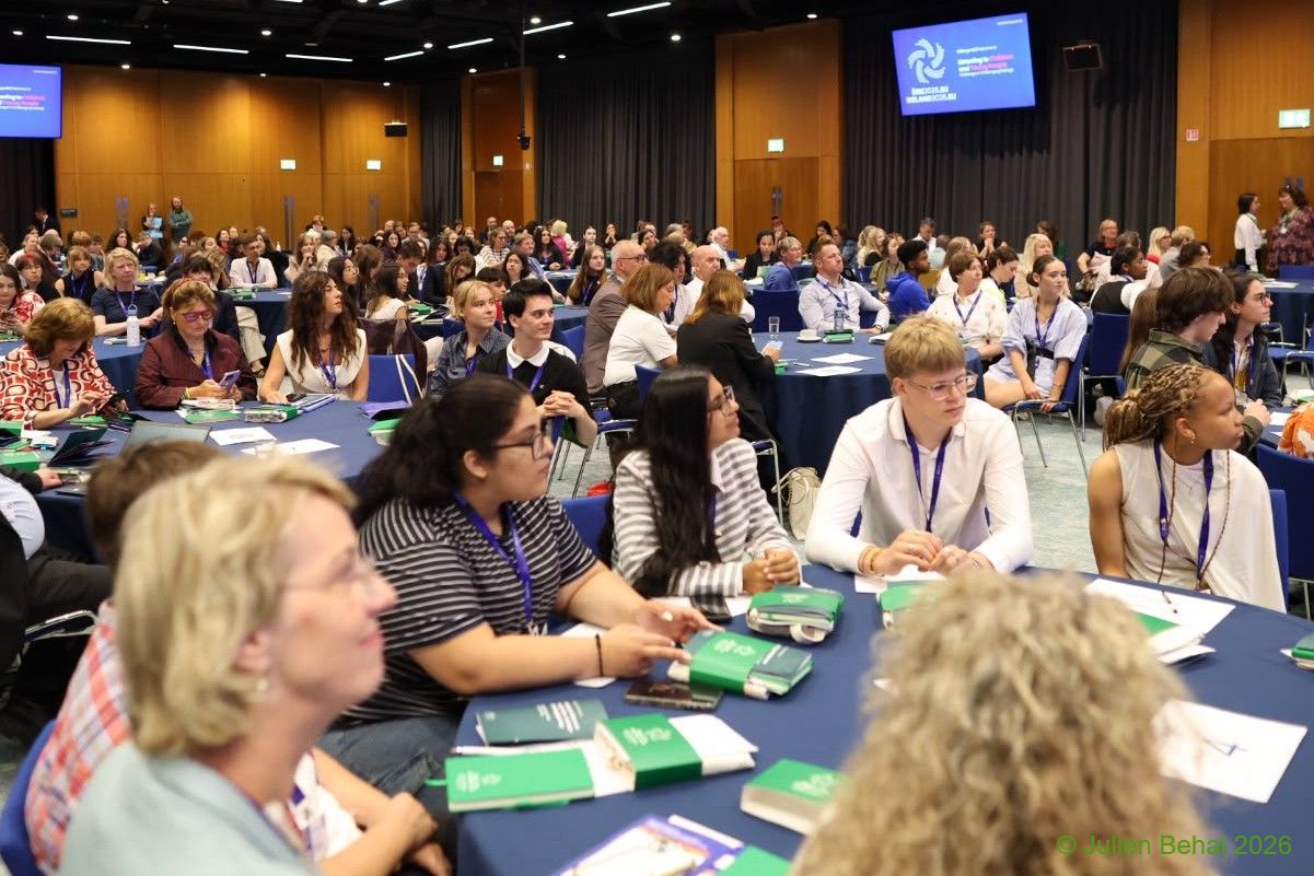 A conference room in Dublin full of children, teens and adults.