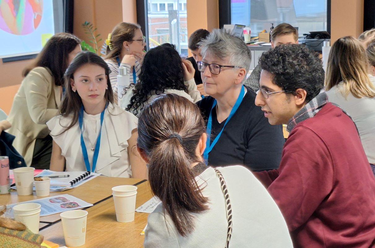 A group of teen Board members in a facilitated discussion session