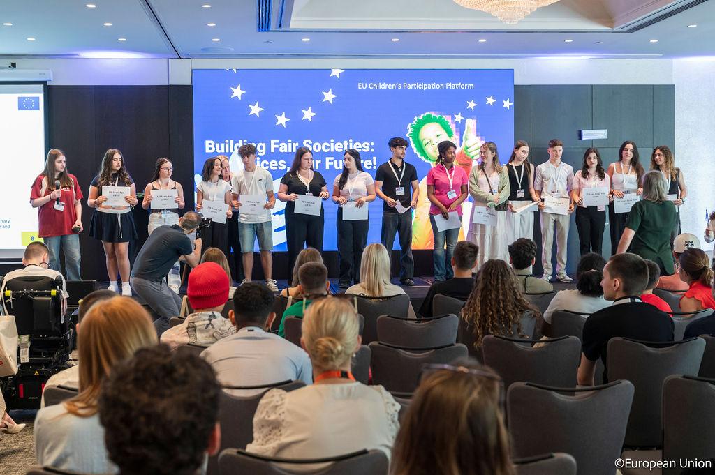 A large group of teenagers on stage at the General Assembly meeting