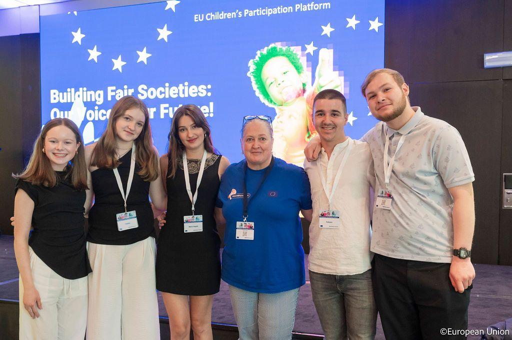 Five teenage co-creation team members with the adult facilitator