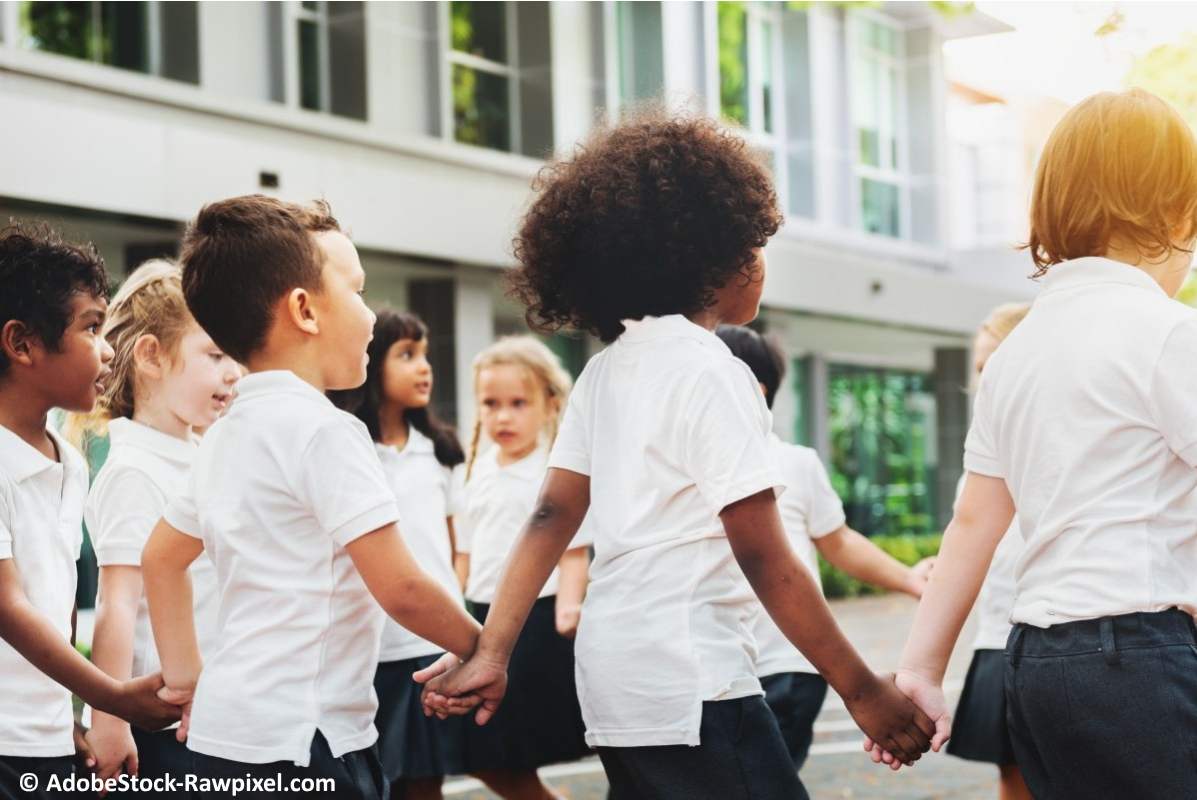 A group of children playing a game in the school yard