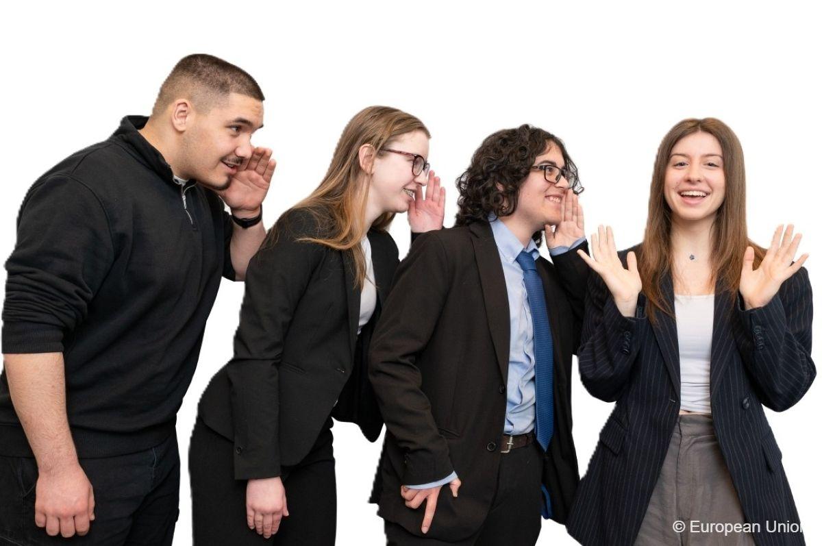 Four European teens in a row talking into each other's ears in different languages.