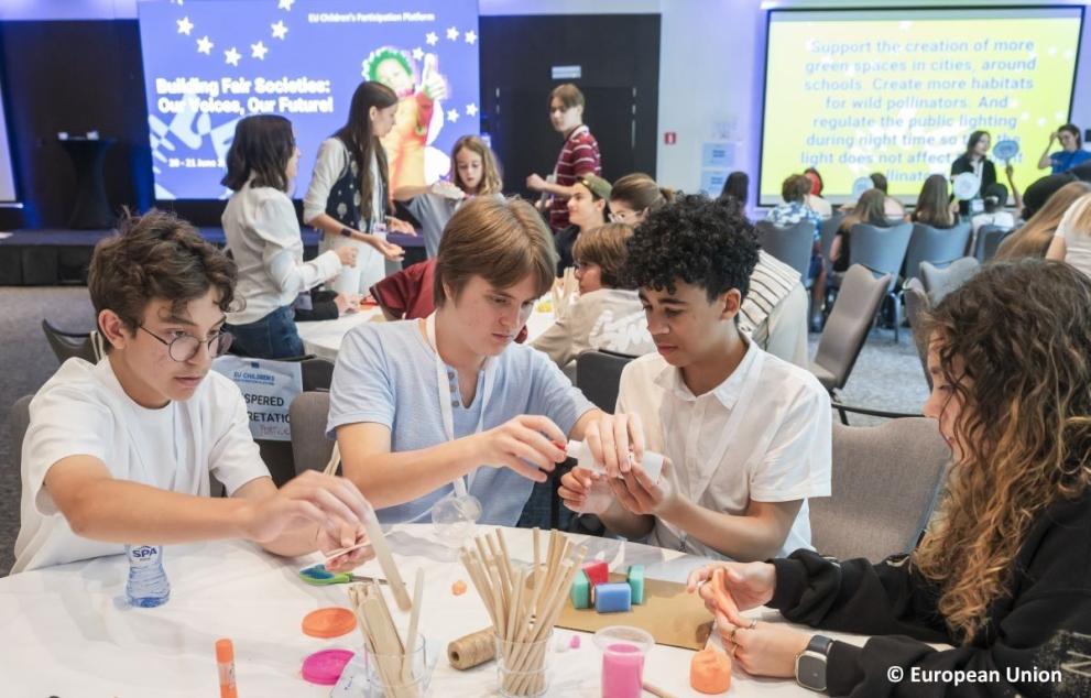 Children participating in a group activity at a workshop during the General Assembly 2025.
