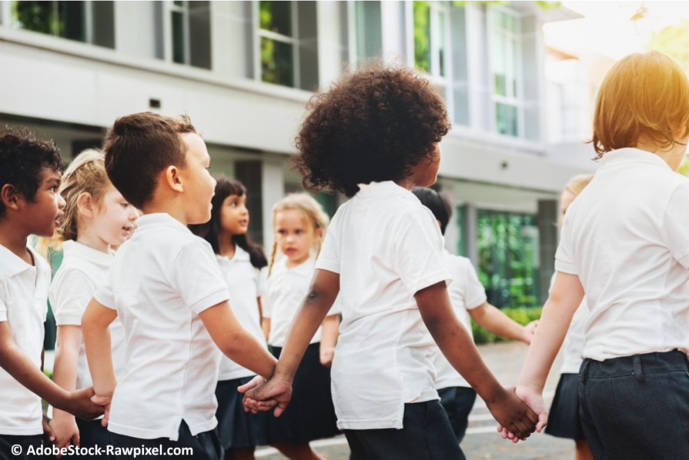 A group of children playing a game in the school yard