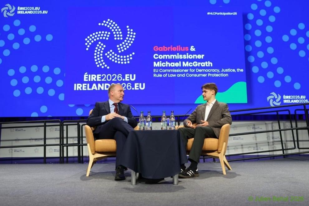Gabrielius and Commissioner McGrath having an on-stage discussion.